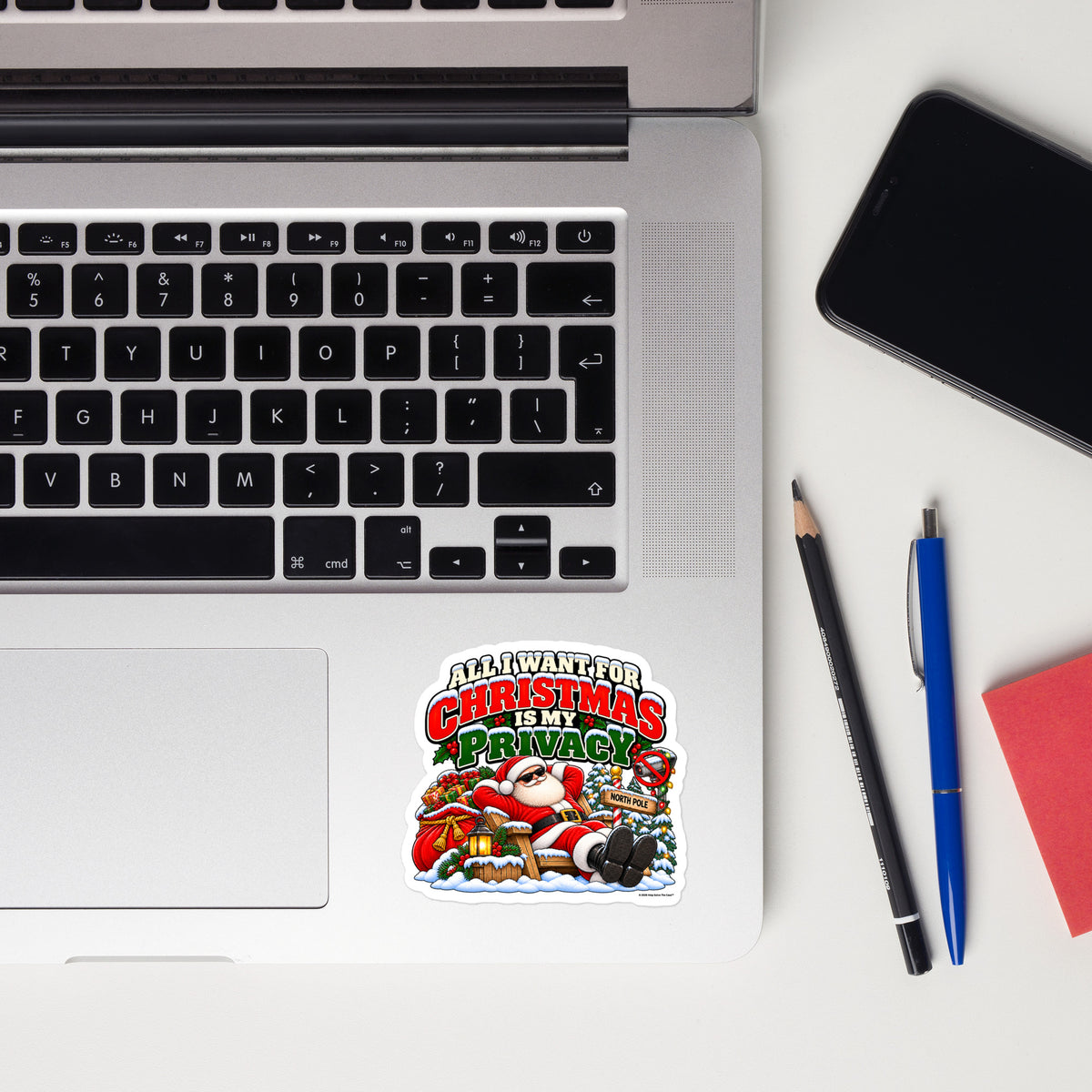 All I Want For Christmas Is Privacy — Christmas Sticker — front lifestyle (sticker by laptop)